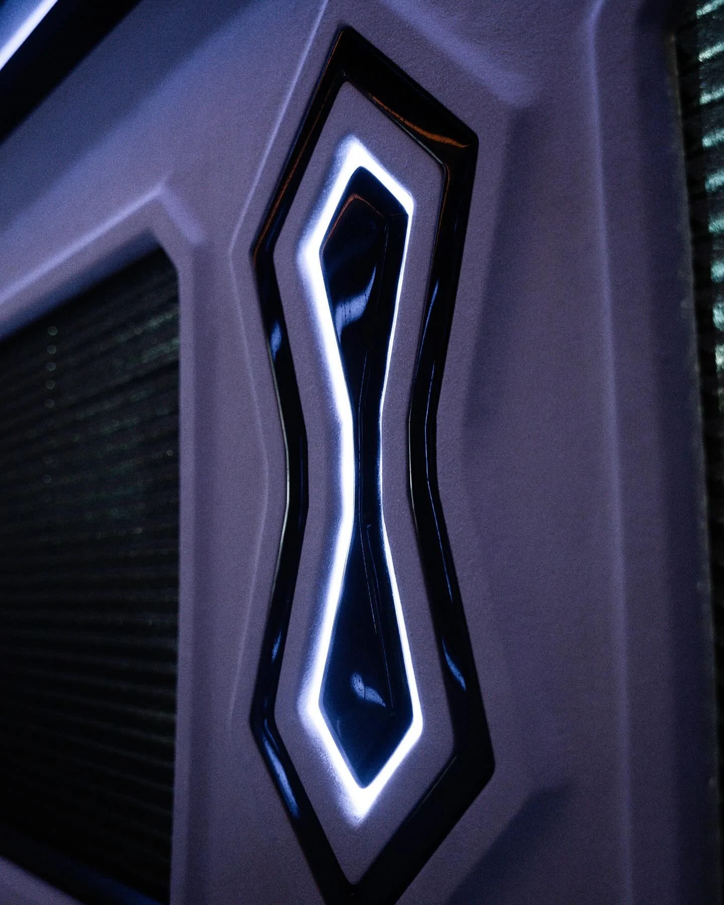 An illuminated geometric wall detail