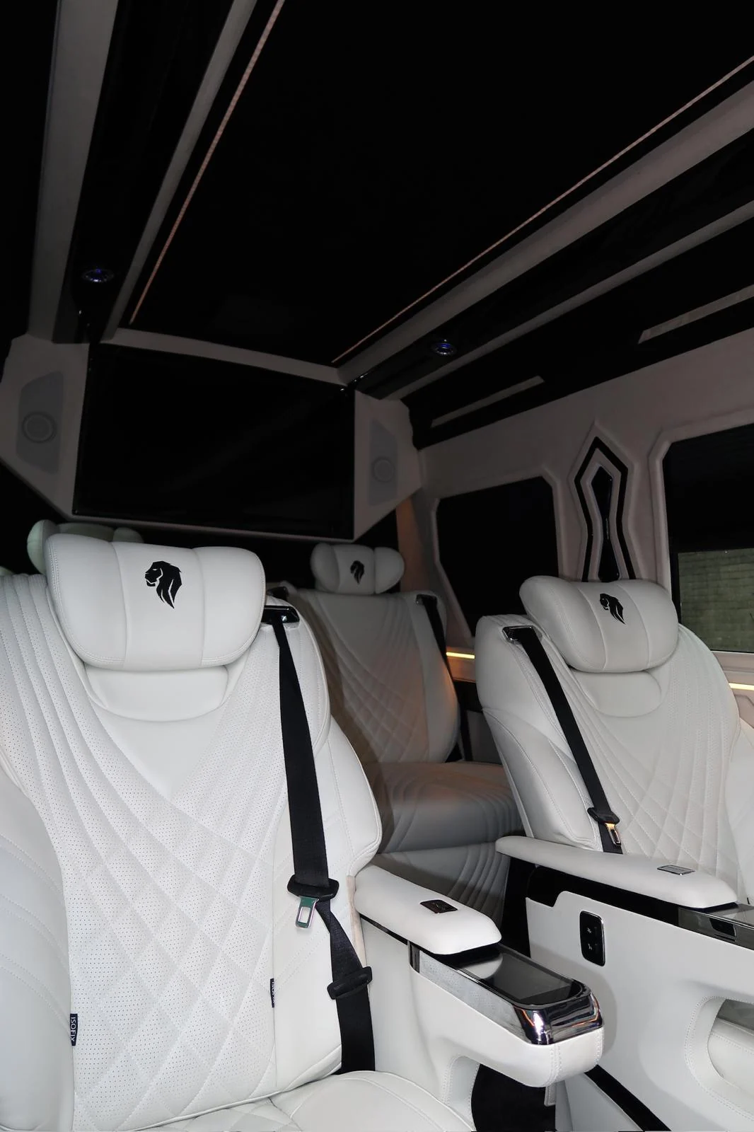 White captain seats with V-Protect embroidery in natural light