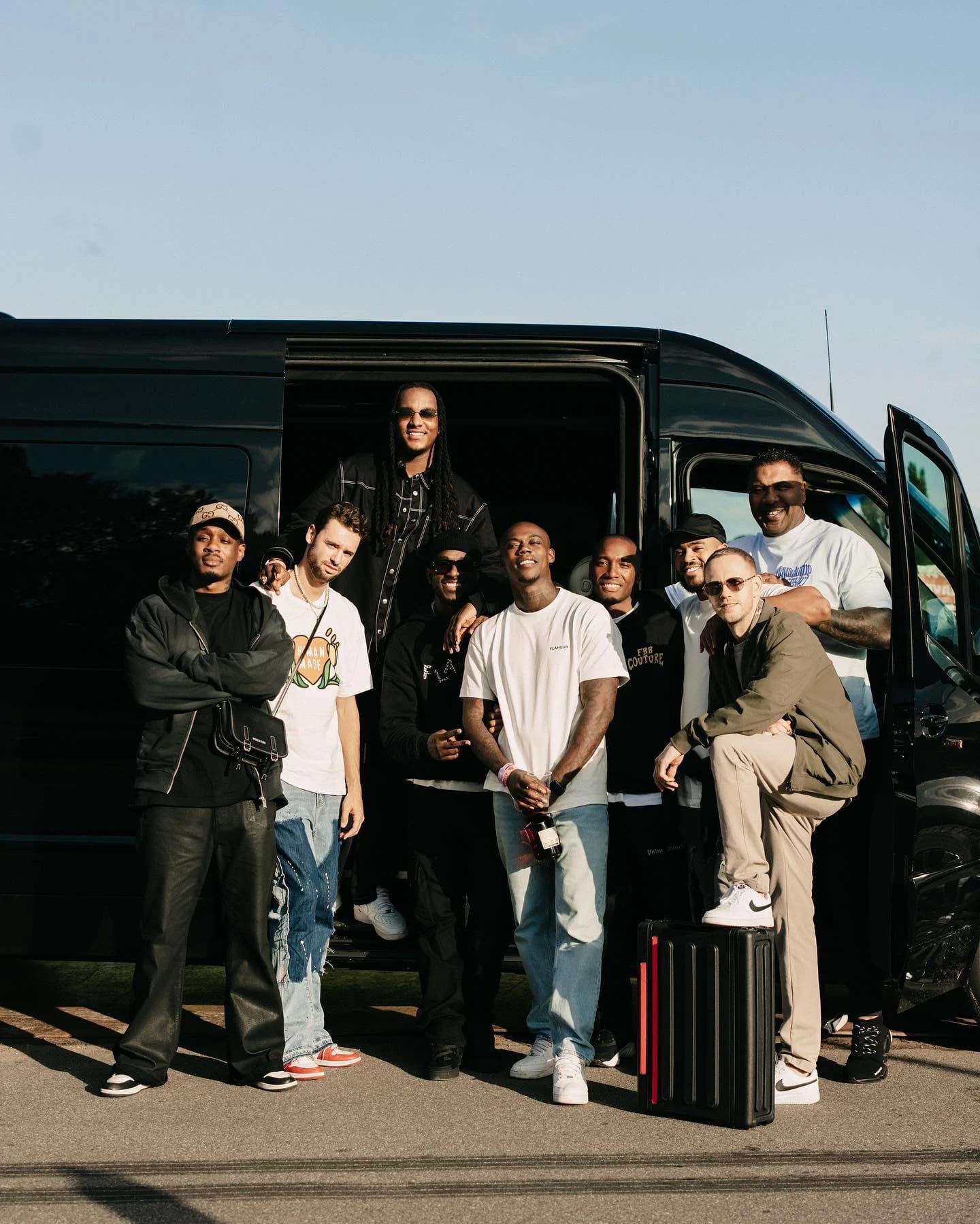 A group beside a black V-Protect vehicle
